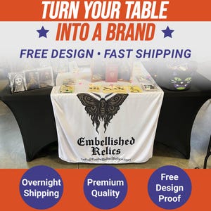 May include: A display table with a white tablecloth featuring a black butterfly design and the text "Embellished Relics." The table is draped with a black cover. Text at the top reads "TURN YOUR TABLE INTO A BRAND." Additional text includes "FREE DESIGN" and "FAST SHIPPING."