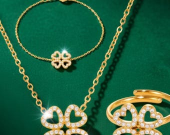 Conjunto de joyería de acero inoxidable con anillo, pulsera y collar, diseño de corazón, flor de cuatro hojas y circonita 5A.