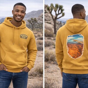 May include: A white ceramic mug with a black handle and the text "But First, Coffee" in a black, bold font. The mug is on a white surface. The mug is approximately 4 inches tall.