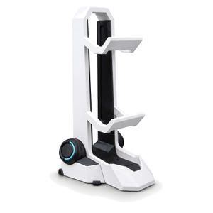 May include: A white and black vertical gaming headset stand featuring a tall frame with two horizontal support arms, a wide base, and two circular side accents with thin blue light rings integrated into the lower structure of the stand.