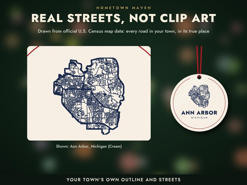 May include: A cream-colored rectangular card featuring a dark blue street map of Ann Arbor, Michigan, alongside a circular tag with the same map, the text ANN ARBOR MICHIGAN, and a red string. The text reads REAL STREETS, NOT CLIP ART.