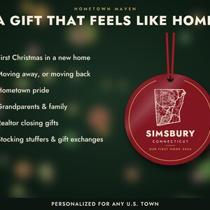 May include: A round red ornament with a white map outline of Simsbury, Connecticut, and the text 'SIMSBURY CONNECTICUT OUR FIRST HOME 2026'. The ornament hangs from a red ribbon against a dark green background with white text listing gift occasions.