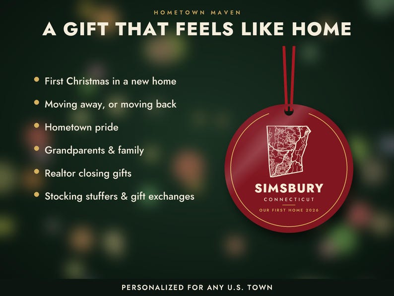 May include: A round red ornament with a white map outline of Simsbury, Connecticut, and the text 'SIMSBURY CONNECTICUT OUR FIRST HOME 2026'. The ornament hangs from a red ribbon against a dark green background with white text listing gift occasions.