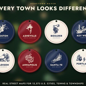 May include: Eight circular ornaments featuring street maps of U.S. cities including Boston, Asheville, Boulder, Key West, Madison, Annapolis, Santa Fe, and Portland. Each ornament displays the city name and state in white or dark blue text.