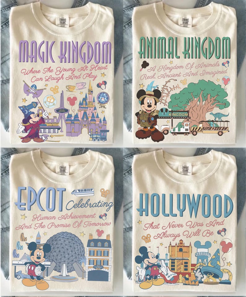 May include: Four cream-colored t-shirts featuring Disney park themes. The shirts display graphics of Mickey Mouse, park landmarks, and text including Magic Kingdom, Animal Kingdom, Epcot, and Hollywood, with slogans like Where The Young At Heart Can Laugh And Play.
