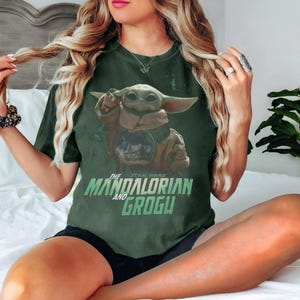 May include: A set of three ceramic canisters with lids. The canisters are white with a blue floral pattern. The largest canister is 20 cm tall, the medium is 18 cm, and the smallest is 15 cm.