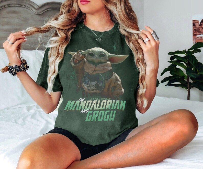 May include: A set of three ceramic canisters with lids. The canisters are white with a blue floral pattern. The largest canister is 20 cm tall, the medium is 18 cm, and the smallest is 15 cm.