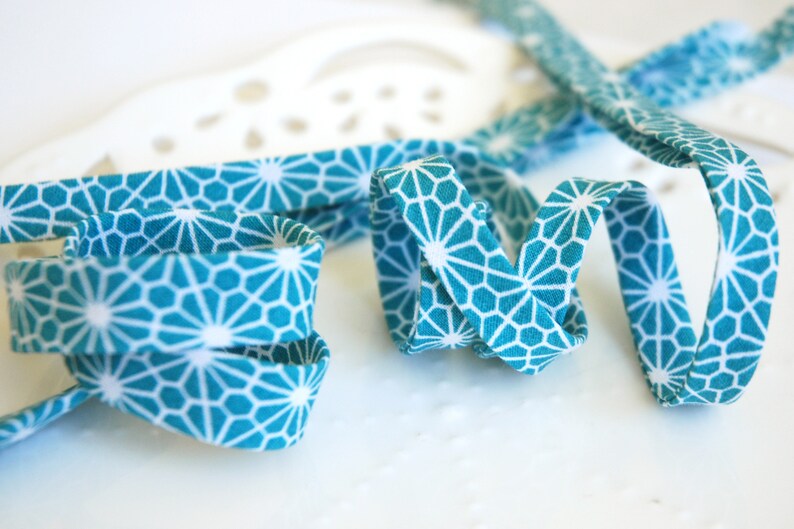double fold geometric flower on turquoise CHOOSE 38 or 12 wide 3 yards bias tape
