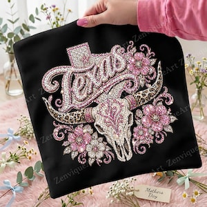 May include: Black pillowcase with a rhinestone design featuring the word "Texas" in a sparkling font, a steer skull, and pink floral accents. The design includes a star and a leopard print pattern.