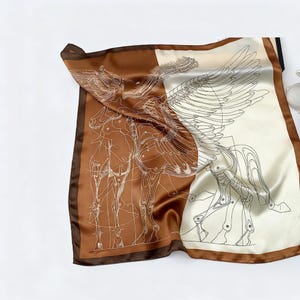 May include: A square silk scarf featuring a detailed illustration of a winged horse, in a brown and cream color scheme. The design has a schematic, anatomical style, with a dark brown border.