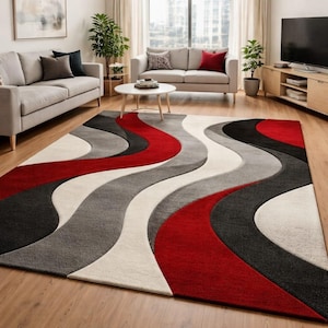 Könnte beinhalten: Ein großer Teppich mit wellenförmigem Design in Rot, Schwarz, Grau und Weiß. Der Teppich liegt auf einem Holzboden in einem Wohnzimmer, mit Sofas und einem Couchtisch im Hintergrund.