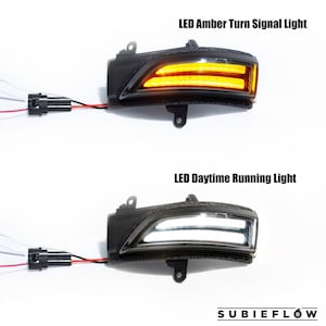 May include: Two black LED car lights are displayed, one with amber turn signal and the other with white daytime running light. The lights are labeled with the text "LED Amber Turn Signal Light" and "LED Daytime Running Light". The SubieFlow logo is at the bottom.