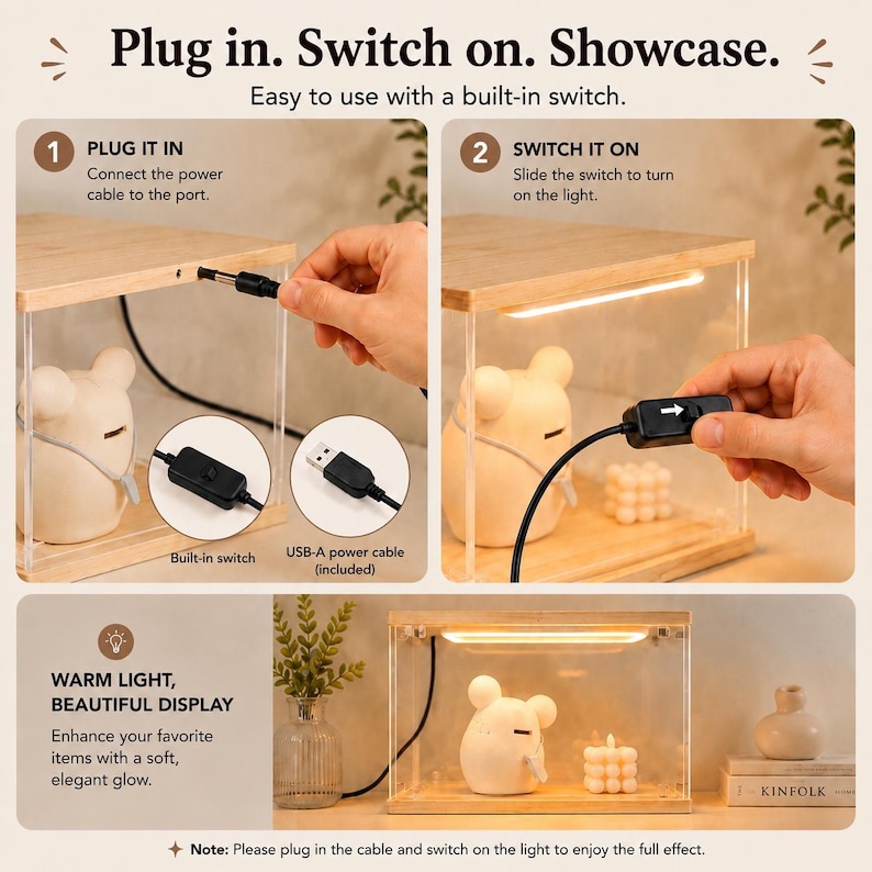May include: A rectangular display case with a light-colored wooden frame and clear acrylic sides. It features an integrated LED light strip, a black power cable with a built-in switch, and a USB-A connector. Text reads: Plug in. Switch on. Showcase.