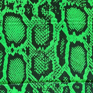 May include: A fabric featuring a high-contrast snakeskin pattern in vibrant neon green and deep black. The design consists of irregular, interlocking organic shapes filled with a fine, textured scale-like grid, creating a bold visual effect.