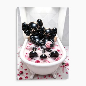 May include: Two black KAWS-style figures with signature X-eyes sit inside a white clawfoot bathtub filled with pink bubble bath and scattered pink rose petals. The figures are glossy black with gold-colored X marks on their eyes.