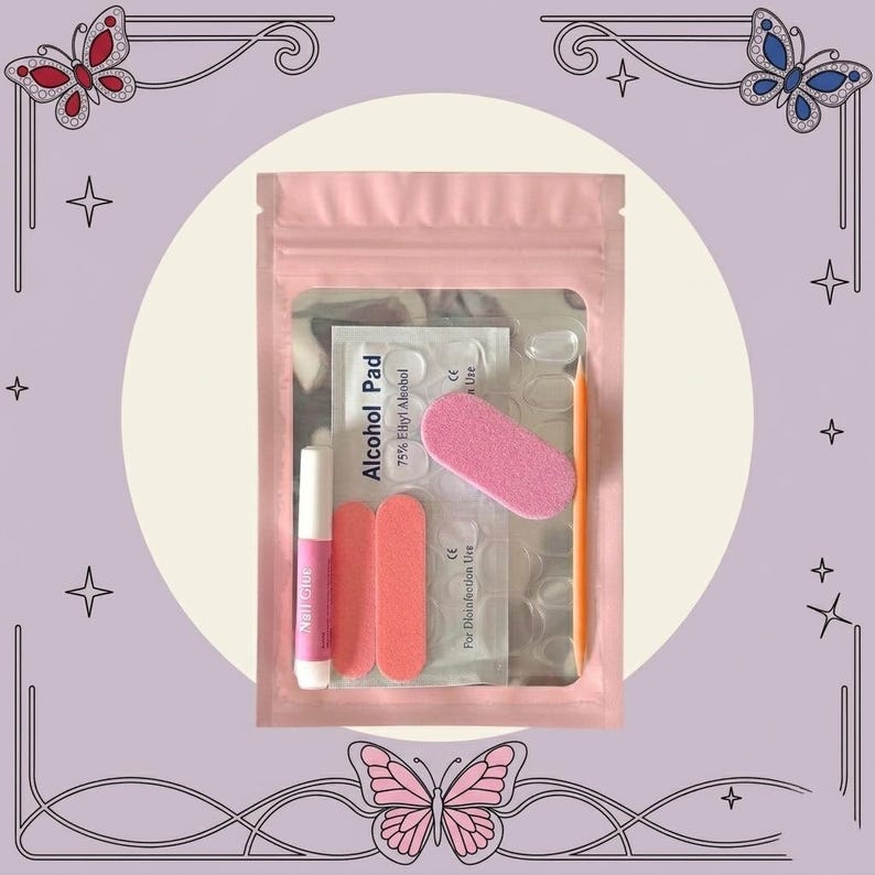May include: A pink resealable pouch containing a nail application kit. Inside are a small tube of nail glue, two rectangular pink nail files, one oval pink nail buffer, an orange wooden cuticle stick, and a packet labeled Alcohol Pad.