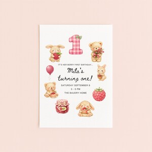May include: A white invitation card with illustrations of cartoon animals, berries, and a number one. The text reads "Mila's turning one!" with the date and time of the event. The card has a playful and whimsical design.