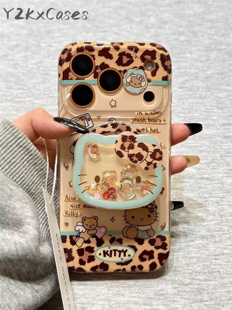 Funda magnética de Hello Kitty con diseño de leopardo para iPhone 17 - Soporte 3D con movimiento - Para iPhone 16, 15, 14 y 13 Pro Max MagSafe Case&Stand