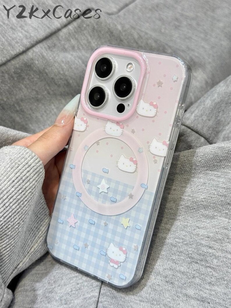 May include: A clear phone case with a pink and blue design. The case features a pink border, a Hello Kitty pattern, and a blue and white checkered pattern. The text "Y2kXCases" is at the top.