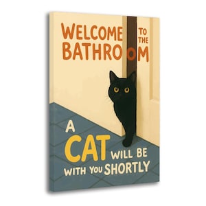May include: A canvas print with the text "WELCOME TO THE BATHROOM" and "A CAT WILL BE WITH YOU SHORTLY." A black cat peeks from behind a door. The background is a light beige with a blue tiled floor.