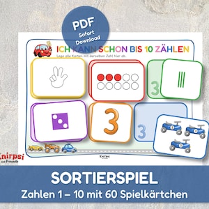 以下が含まれることがあります： 数字合わせカードを使った、カラフルな教育ゲーム。カードには数字、サイコロのパターン、オブジェクトのイラストが表示されています。「ICH KANN SCHON BIS 10 ZÄHLEN」の文字が見えます。ゲームにはPDFダウンロードオプションが含まれています。