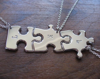 Three Silver Puzzle Pendant Necklaces