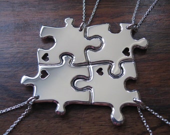 Four Silver Puzzle Pendants with Hearts