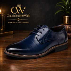 May include: A navy blue leather oxford shoe with a polished finish, featuring a rounded toe, tonal laces, and subtle brogue detailing along the side panels. The shoe has a dark brown midsole and a black outsole with a low heel.