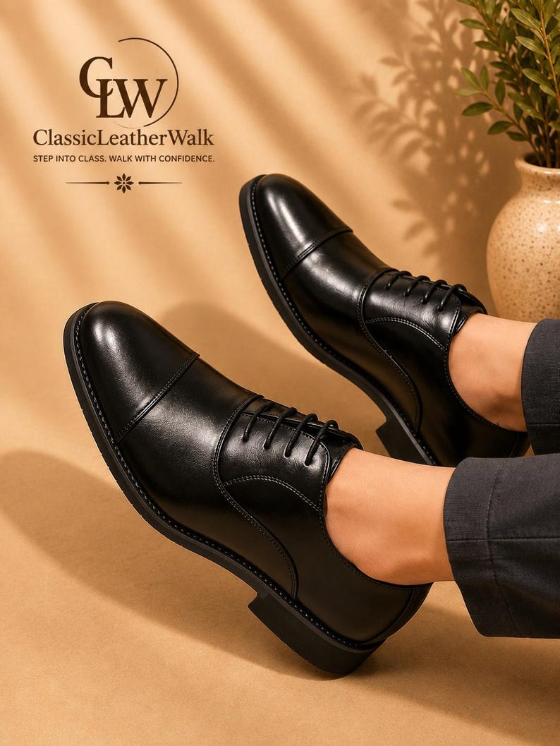 May include: A pair of black leather cap-toe oxford shoes with black laces and a low heel. The text GW ClassicLeatherWalk STEP INTO CLASS. WALK WITH CONFIDENCE. is visible in the upper left corner above the shoes.