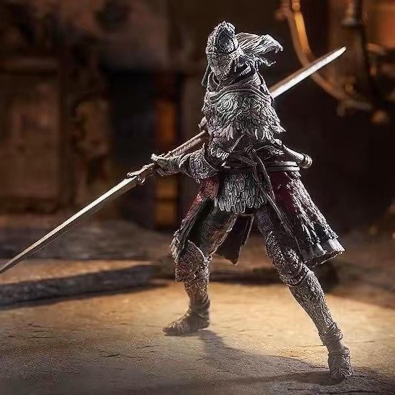 May include: A detailed figurine of a warrior in ornate armor, holding two large swords. The figure is predominantly silver and red, with intricate detailing on the helmet, chest, and legs. The warrior is posed in a dynamic stance, suggesting action.