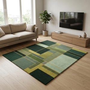 May include: Geometric patterned area rug in shades of green, with gold accent lines. The rug features a modern design with various rectangular and square shapes. The rug is placed on a wooden floor in a living room setting.