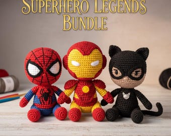 May include: A bundle of three crocheted superhero dolls: Spider-Man, Iron Man, and Catwoman. Spider-Man is red and blue, Iron Man is red and yellow, and Catwoman is black. The text "SUPERHERO LEGENDS BUNDLE" is displayed above the dolls.
