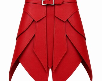 May include: A bright red skirt featuring a high-waisted design with a silver-toned metal buckle belt. The garment is constructed with multiple overlapping, pointed panels that create a layered, angular silhouette with a split front hem.