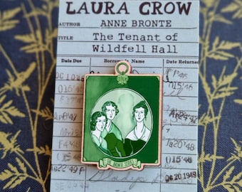 Insignia de madera con retrato de las hermanas Brontë