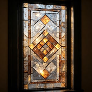 May include: A stained glass window with a geometric design. The window features a central diamond pattern in shades of brown and gold, surrounded by rectangular and square panels. The glass has a textured appearance, and the frame is dark.
