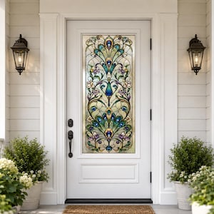 May include: A white front door with a stained glass window featuring a peacock feather design in shades of blue, green, purple, and gold. The door is flanked by two black sconce lights and potted plants.