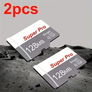 May include: Two grey and white Super Pro 128MB Smart Cards are shown. The cards have red text that reads "Super Pro" and "128MB". The text "2pcs" is in red at the top of the image.