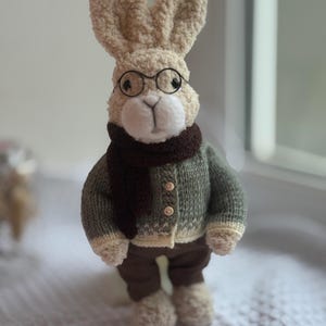 May include: A set of three ceramic mugs with a speckled, matte finish. The mugs are in shades of cream, light gray, and dark gray. Each mug has a simple, minimalist design, perfect for coffee or tea.