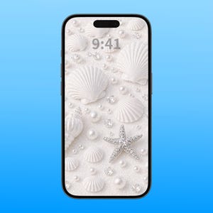May include: A smartphone displaying a digital wallpaper featuring a white textured background with scattered white seashells, pearls, and sparkling clear crystals. The time 9:41 is displayed in grey at the top center of the screen.