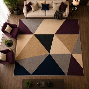 May include: A large rectangular area rug featuring a geometric pattern of triangles and polygons in shades of deep purple, charcoal gray, beige, and black. The rug has a textured, tufted surface and is positioned in the center of a living room floor.
