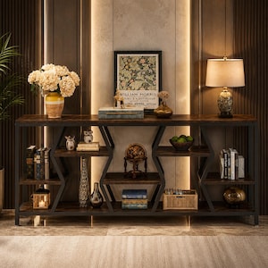May include: A dark brown and black console table with multiple shelves. The table has a metal frame and a wooden top. The shelves are filled with books, decorative items, and a lamp. A framed print with the text "WILLIAM MORRIS" is on the top shelf.