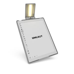 May include: A grey e-reader with an integrated light, positioned at an angle. The screen shows the word "UMLAUT" in black. The e-reader has a slim, grey frame and a series of icons down the left side.