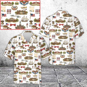 May include: White short-sleeved button-down shirt with a repeating pattern of historical American imagery. The design includes flags, buildings, cannons, ships, and patriotic emblems. The shirt has a classic collar and a relaxed fit, suitable for casual wear.