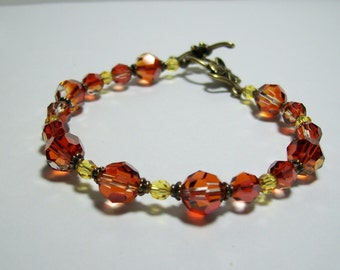 Swarovski Crystal Bracelet. Red Magma and Light Topaz Crystals. Crystals and Brass. Sparkly. Autumn.