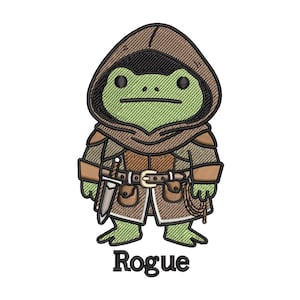 May include: Embroidered patch featuring a green frog character in a brown hooded cloak and armor, holding a sword. The word "Rogue" is embroidered in black below the character. The design has a fantasy theme.