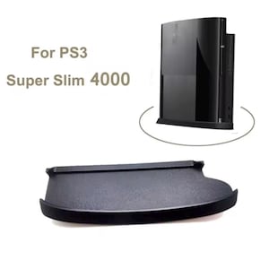 May include: A black PS3 Super Slim 4000 console and a matching black stand. The stand is curved and designed to hold the console upright. Text on the image reads "For PS3 Super Slim 4000".