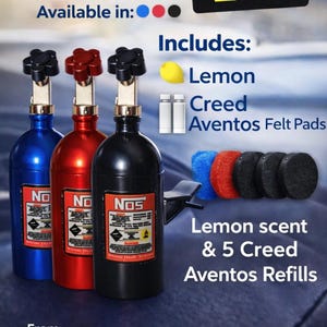 May include: Mini NOS-Style Diffuser available in blue, red, and black. Includes lemon scent and Creed Aventos refills. The image shows three diffusers, a lemon, two small bottles, and felt pads. The text says "Wick-ed Good Scents".