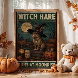 May include: A framed wall art print featuring a rabbit wearing a witch hat sitting on books. The text reads WITCH HARE and RUNS AT MOONRISE. The scene includes a full moon, a lantern, a bottle labeled Harespell Tonic, and a jack-o'-lantern.