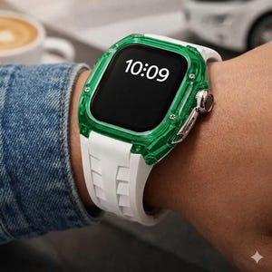 May include: A smartwatch with a white band and a transparent green case is displayed on a wrist. The watch face shows the time as 10:09. The watch has a silver-colored button on the side.