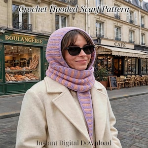 May include: A crochet hooded scarf with alternating horizontal stripes of light purple and soft orange yarn. The hood and scarf are integrated into one piece, worn over a cream-colored coat. The text Crochet Hooded Scarf Pattern and Instant Digital Download are visible.